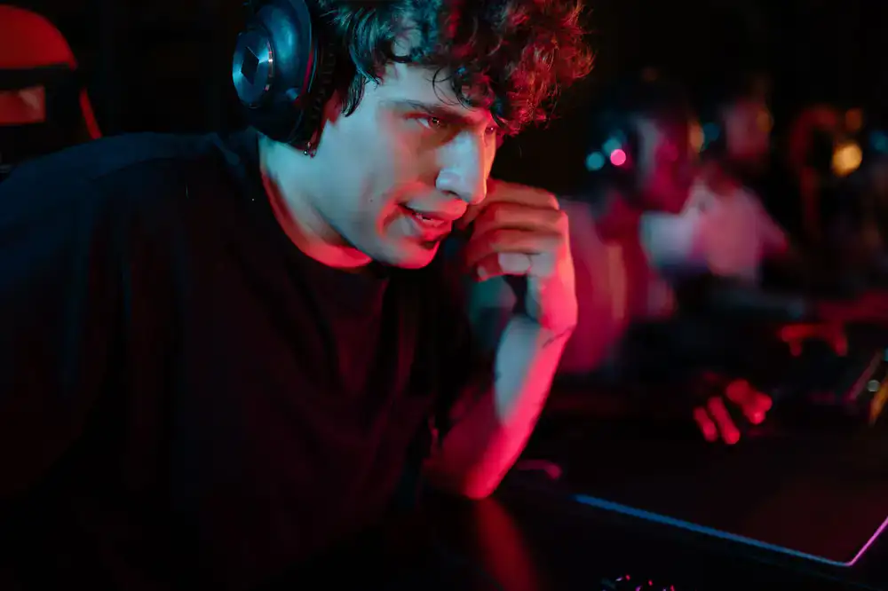 Two players focused on their screens during a tournament