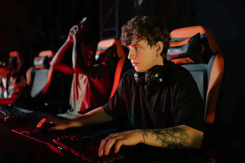 Wide shot of a local LAN setup with players engaged in a match