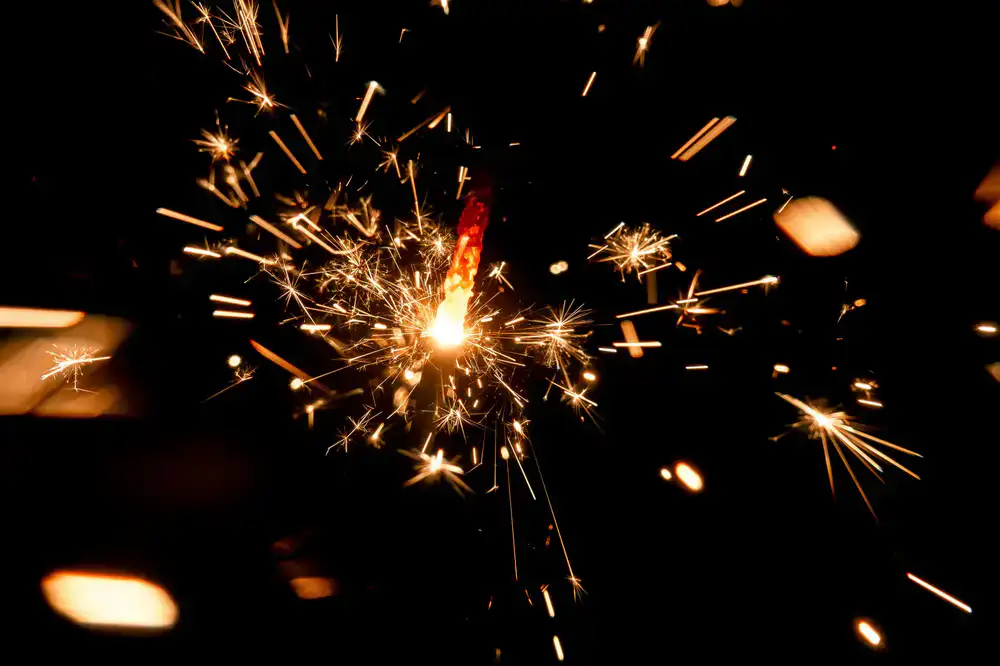 Abstract glowing sparks on dark background