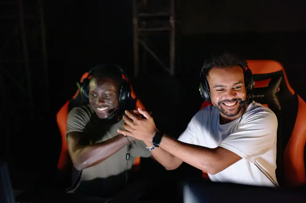 Gamers celebrating a victory at an esports event